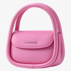 Amazing Song pink handbag with unique double handle design on white background