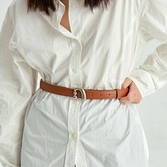 White button-up shirt styled with a brown leather belt, Amazing Song fashion accessory
