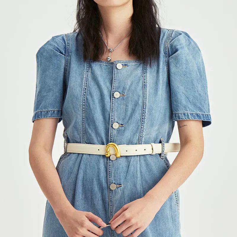 Woman in blue denim dress with short sleeves, white belt, and necklace, Amazing Song