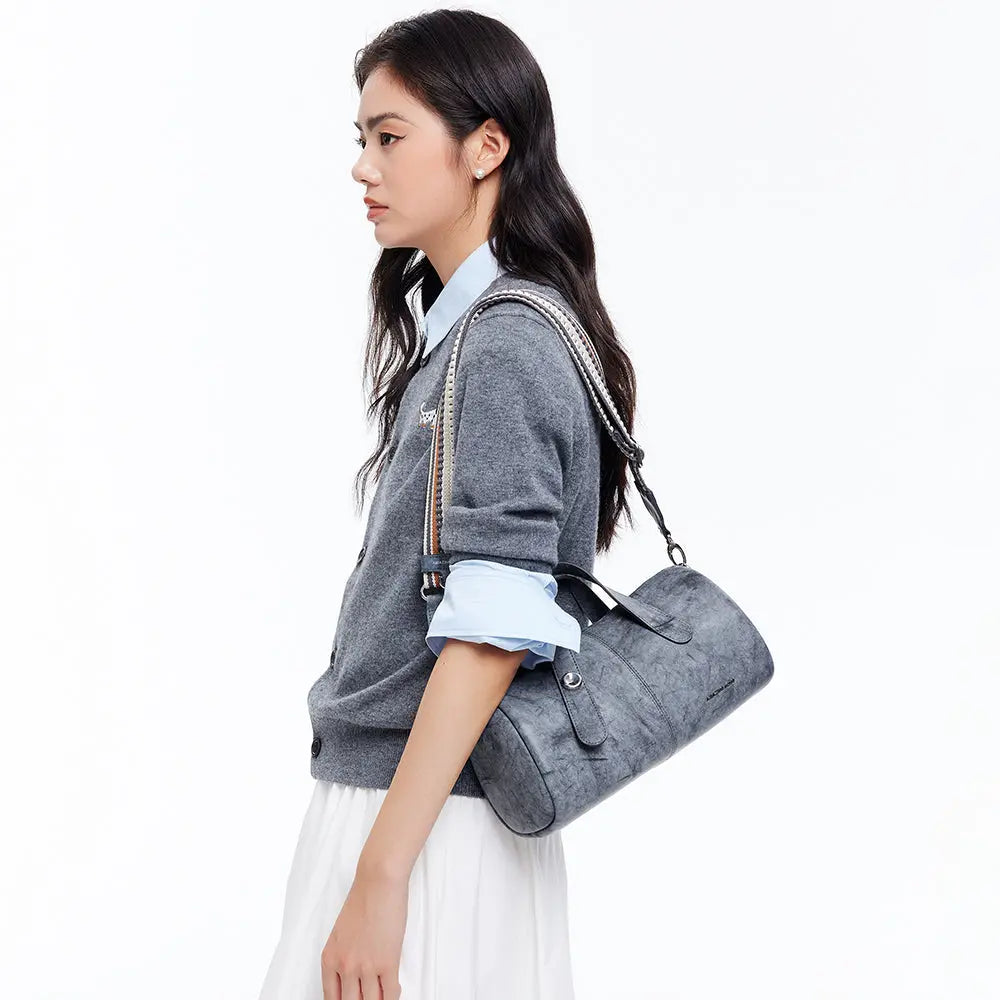 Woman in grey sweater carrying a grey shoulder bag, Amazing Song official website fashion