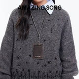 Amazing Song card holder on lanyard, worn over gray beaded sweater, official website promo