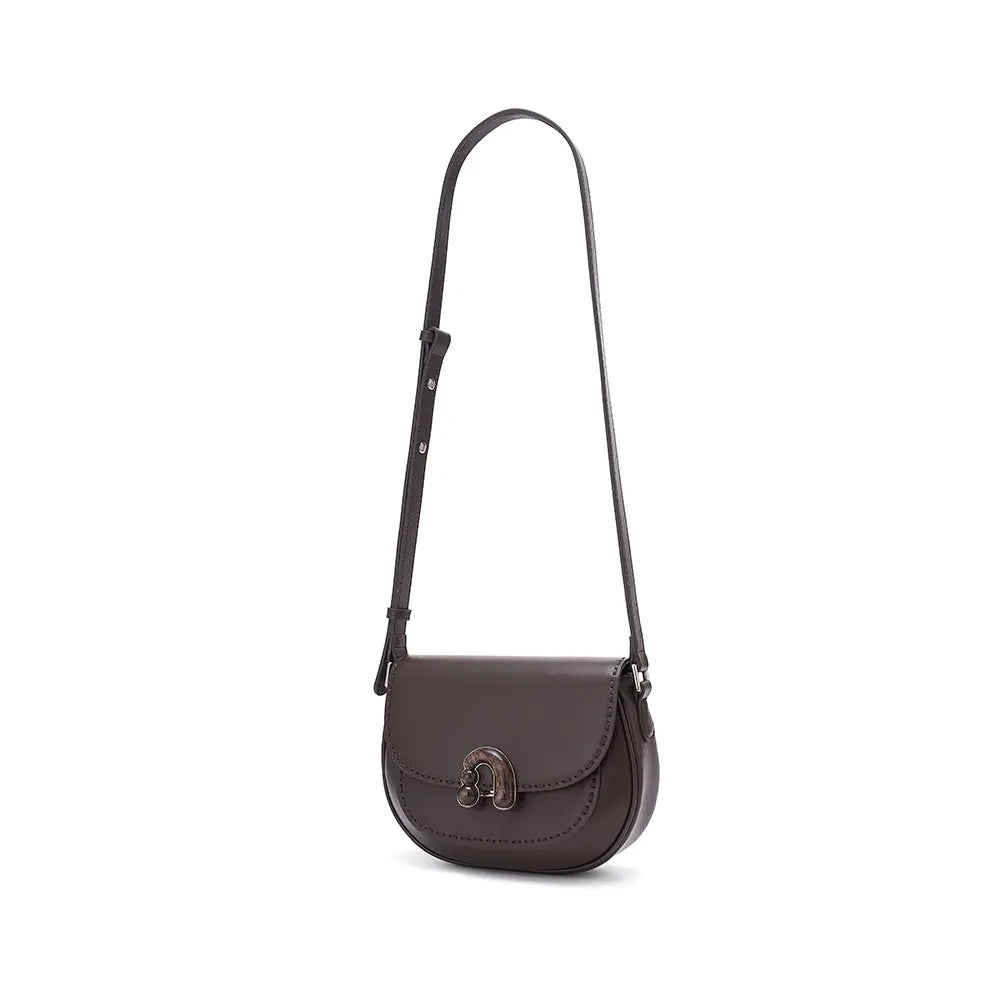 Dark brown leather crossbody bag with adjustable strap and metal clasp on white background