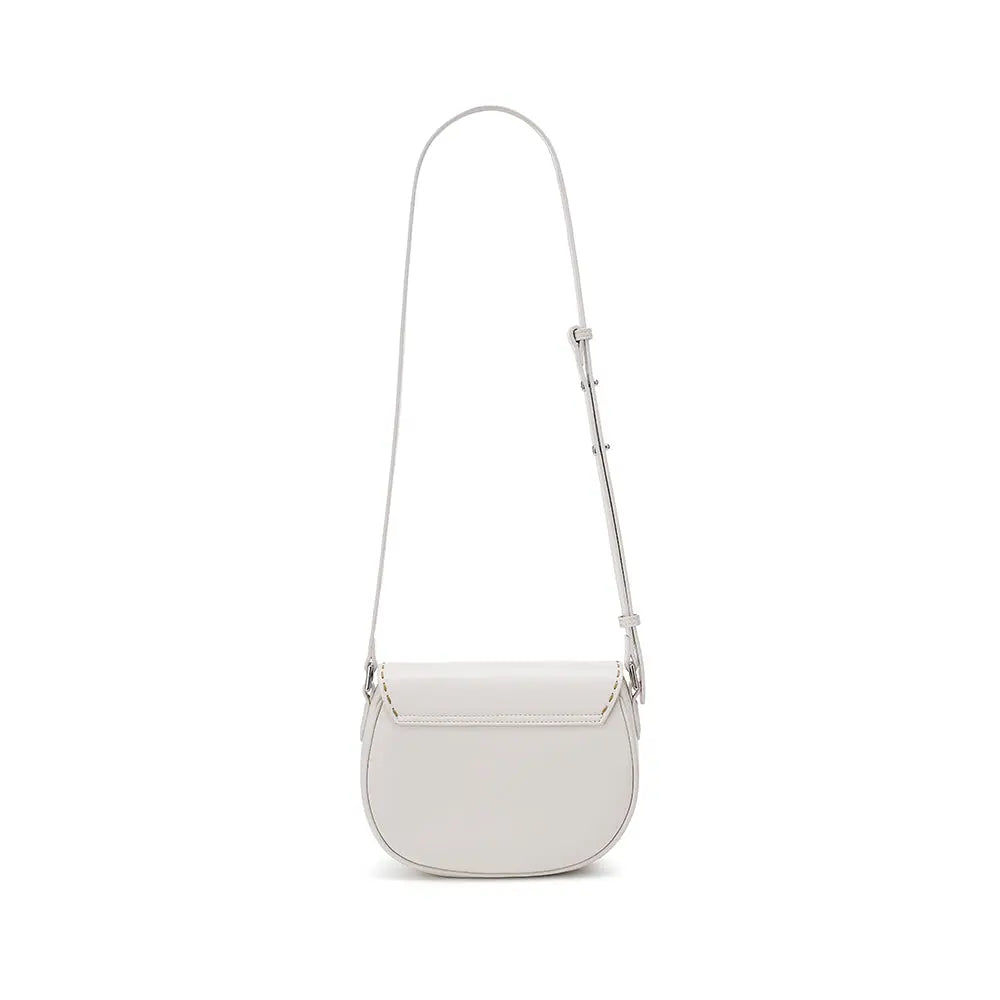 Minimalist white leather crossbody bag with adjustable strap on white background