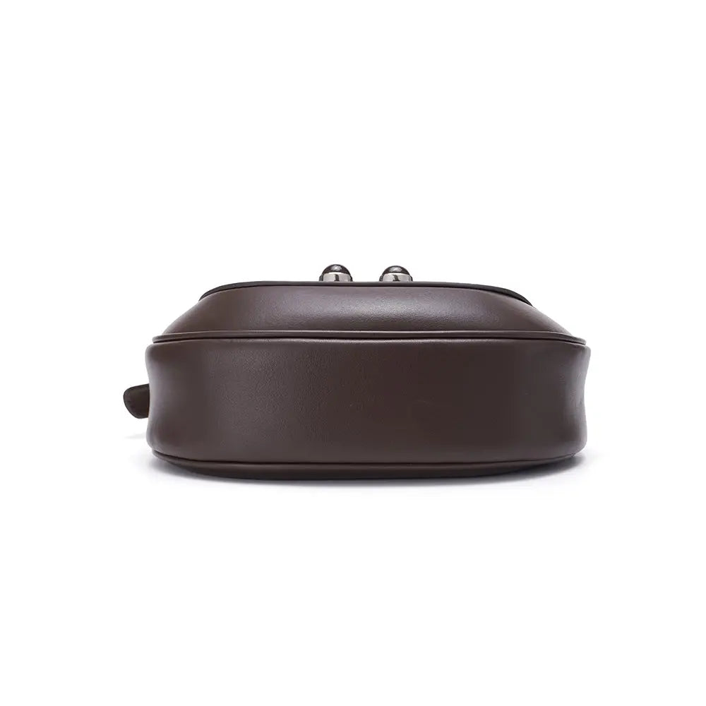Bottom view of a brown leather handbag on white background, Amazing Song official website