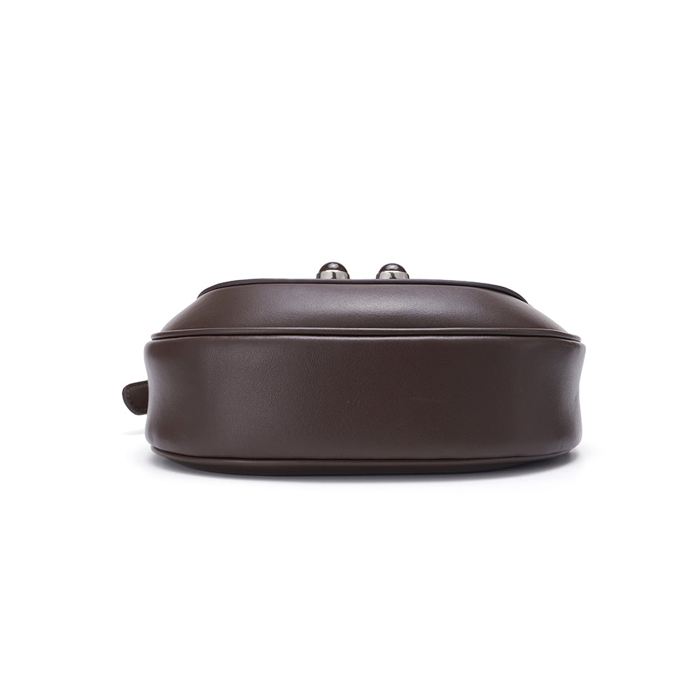 Bottom view of a brown leather handbag on white background, Amazing Song official website