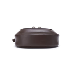 Bottom view of a brown leather handbag on white background, Amazing Song official website