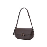 Amazing Song brown leather shoulder bag with metal clasp on white background