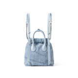 Light blue denim backpack with leather straps, chain accents, on white background