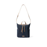 Navy blue canvas shoulder bag with tan leather straps and front pocket, Amazing Song