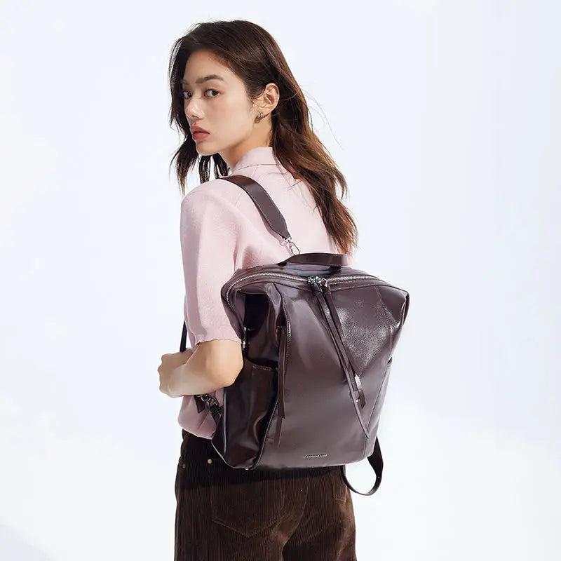Woman in pink top with dark brown leather backpack, Amazing Song official website style