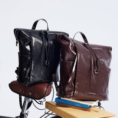 Amazing Song leather backpacks in black and brown on a bike seat with books, official website