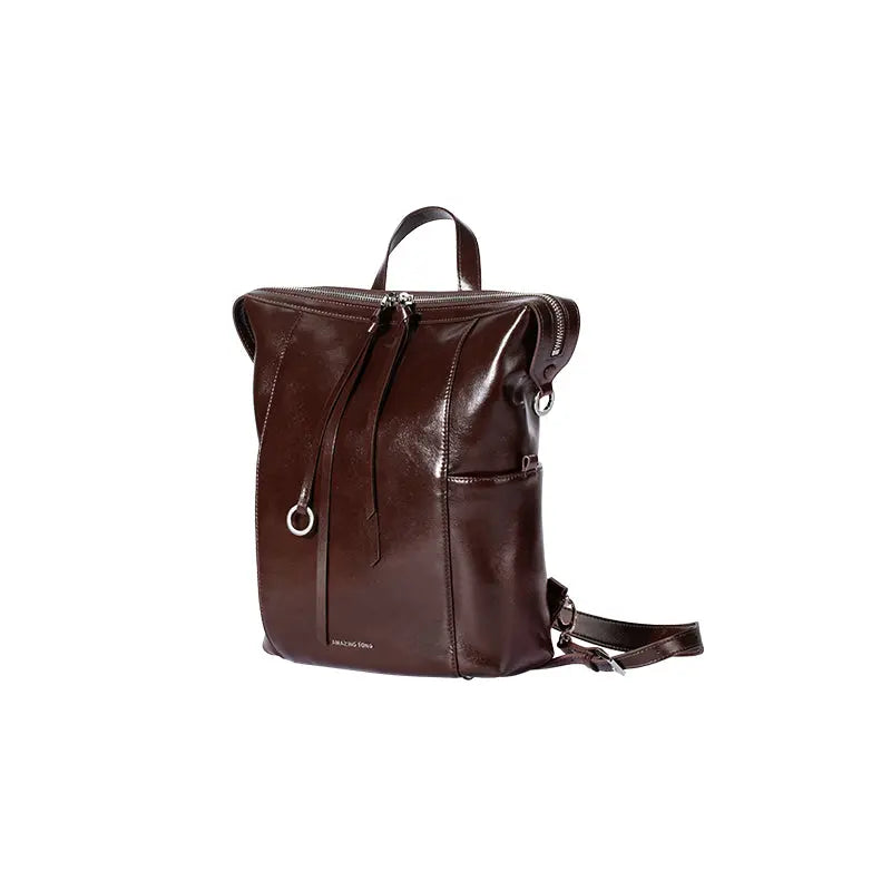 Amazing Song dark brown leather backpack with top handle and side pockets on white background