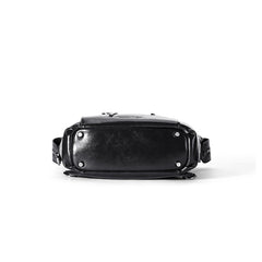 Black leather crossbody bag bottom view, silver hardware, Amazing Song branding