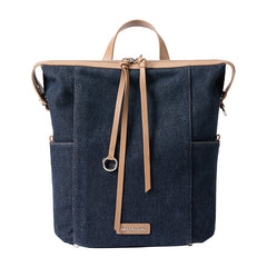 Amazing Song denim backpack with tan leather straps and front logo patch