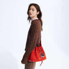 Woman in brown sweater with stylish red suede shoulder bag, Amazing Song fashion