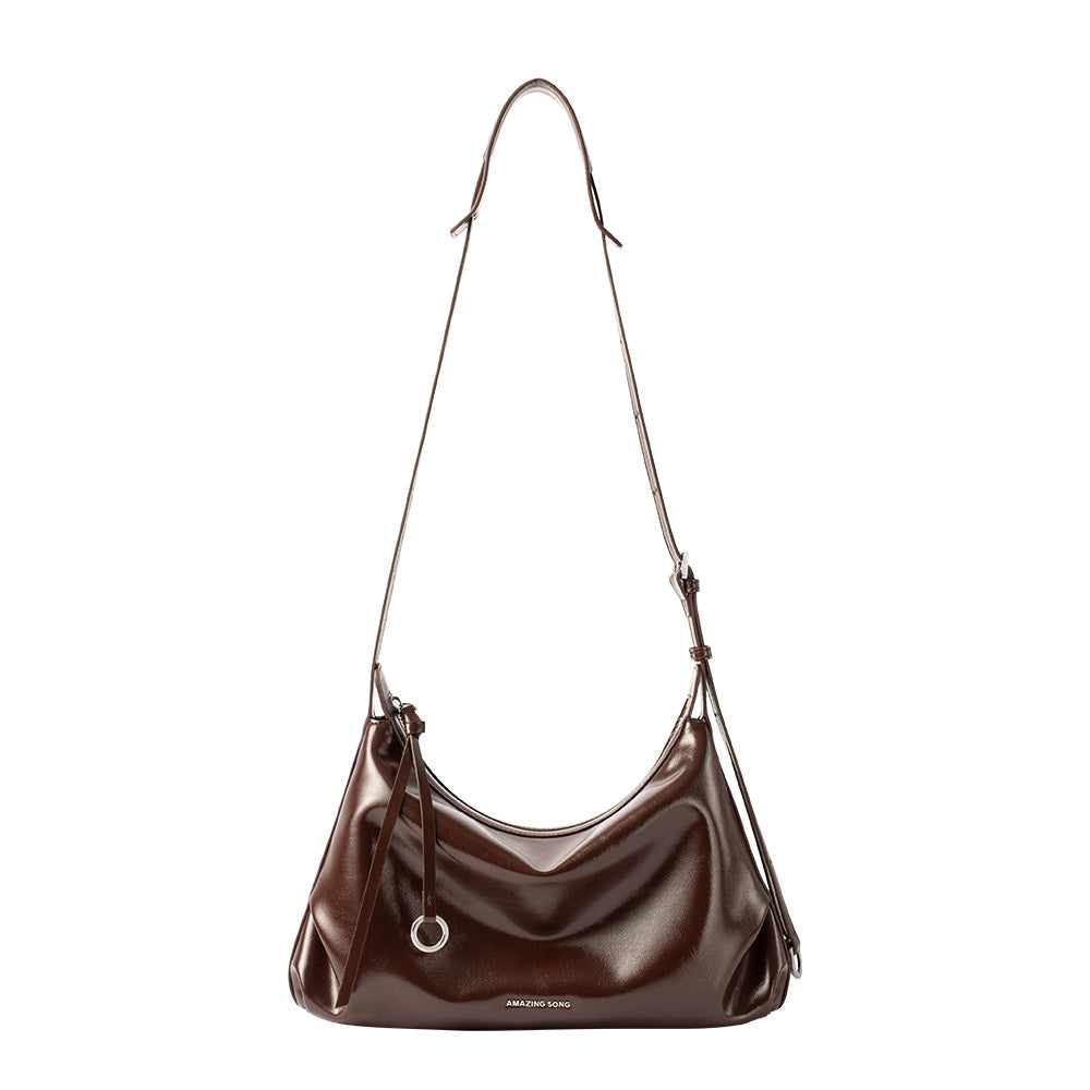 Amazing Song dark brown leather shoulder bag with adjustable strap on white background