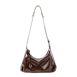 Amazing Song dark brown leather shoulder bag with adjustable strap on white background
