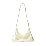 Amazing Song cream shoulder bag with adjustable strap against white background