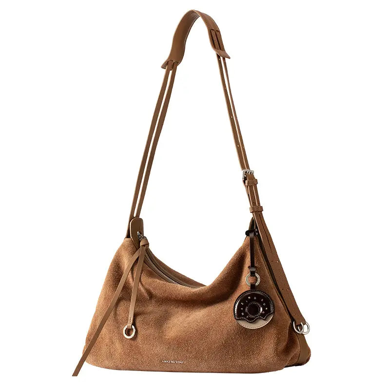 Brown suede shoulder bag with adjustable leather strap and round keychain, Amazing Song