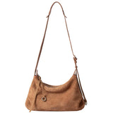 Amazing Song brown suede shoulder bag with adjustable strap on white background