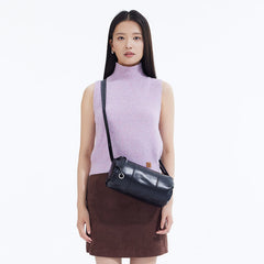 Woman in sleeveless lavender top and brown skirt wearing black crossbody bag, Amazing Song