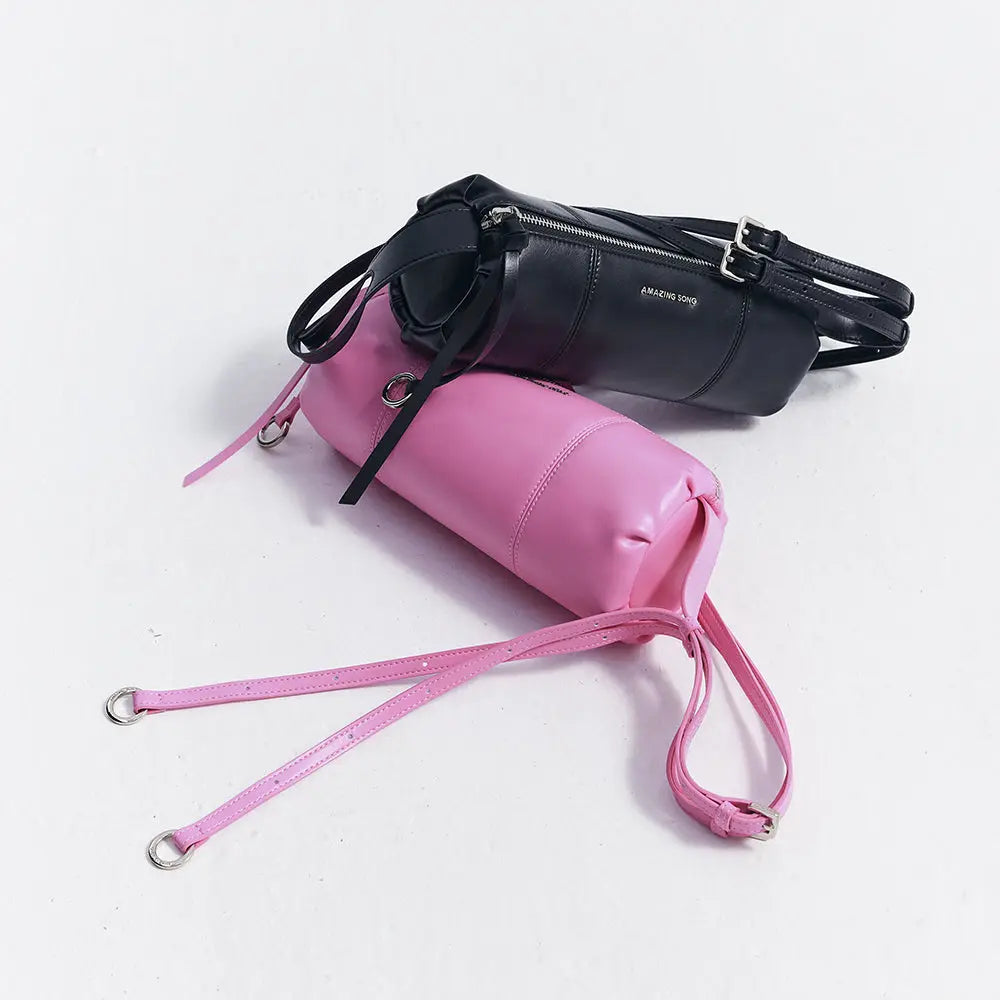 Amazing Song black and pink cylinder handbags with straps on white background