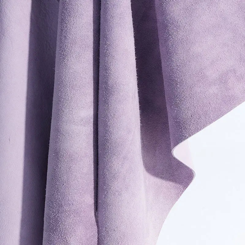 Close-up of soft lavender suede fabric with textured surface, Amazing Song official site