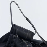 Amazing Song black leather shoulder bag with silver zipper and adjustable strap