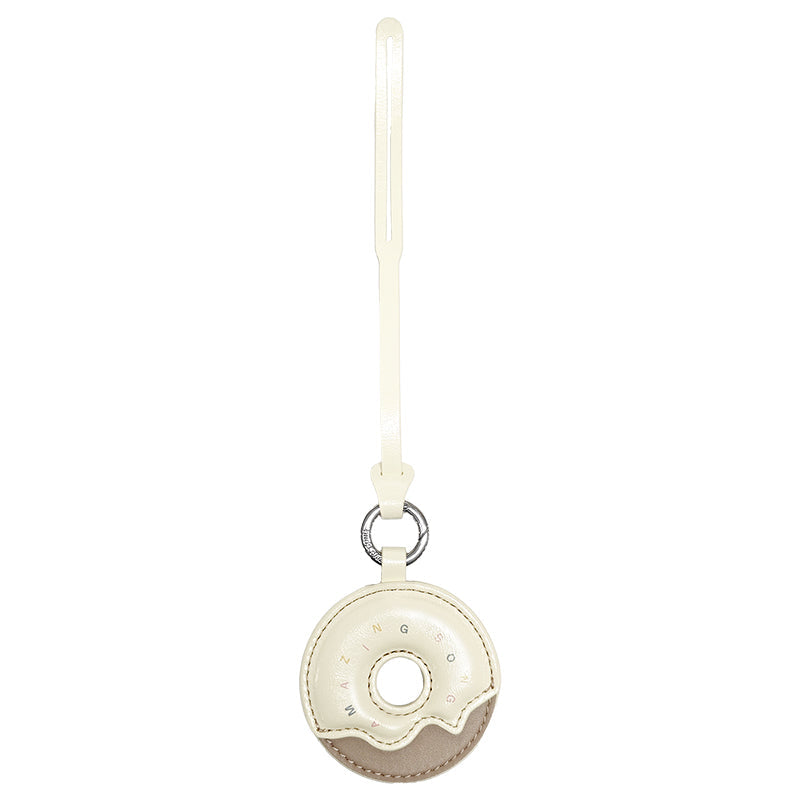Cream and beige donut-shaped Amazing Song leather keychain with strap on white background