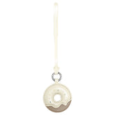 Cream and beige donut-shaped Amazing Song leather keychain with strap on white background