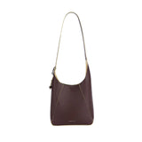 Amazing Song brown leather shoulder bag with cream accents on white background