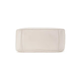 Bottom view of a white woven handbag with leather panels, Amazing Song official website