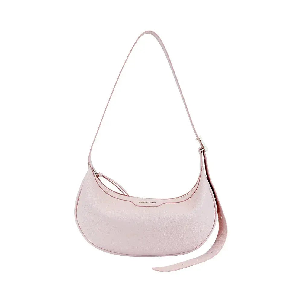 Light pink leather shoulder bag with adjustable strap on white background