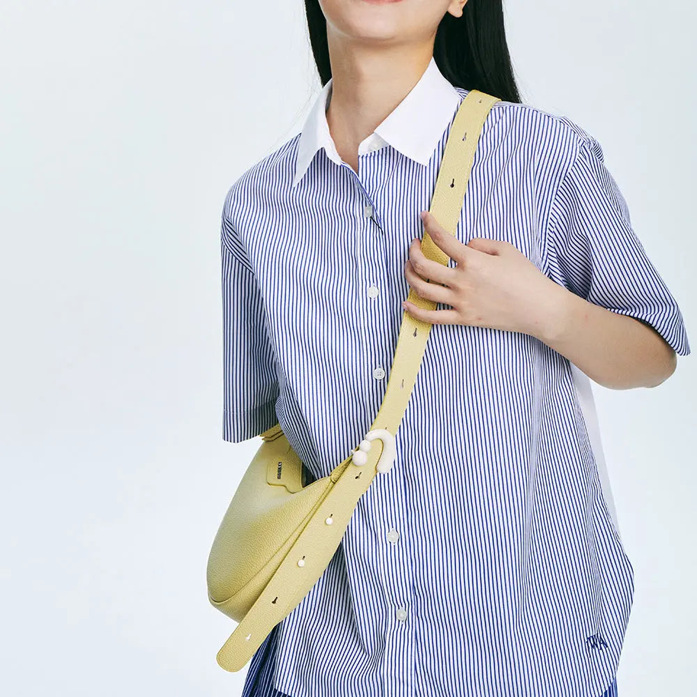 Woman in blue striped shirt wearing yellow crossbody bag, Amazing Song official website