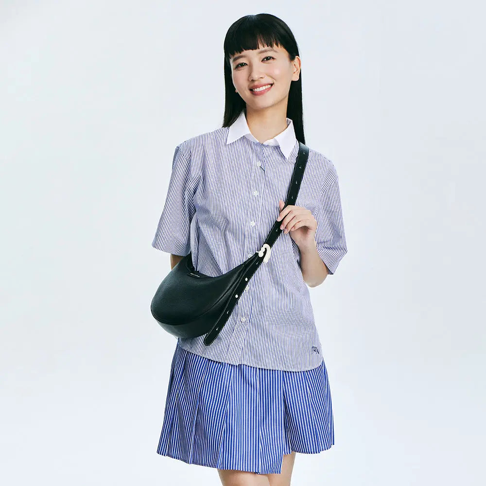 Smiling woman in striped shirt and skirt with black shoulder bag, Amazing Song style