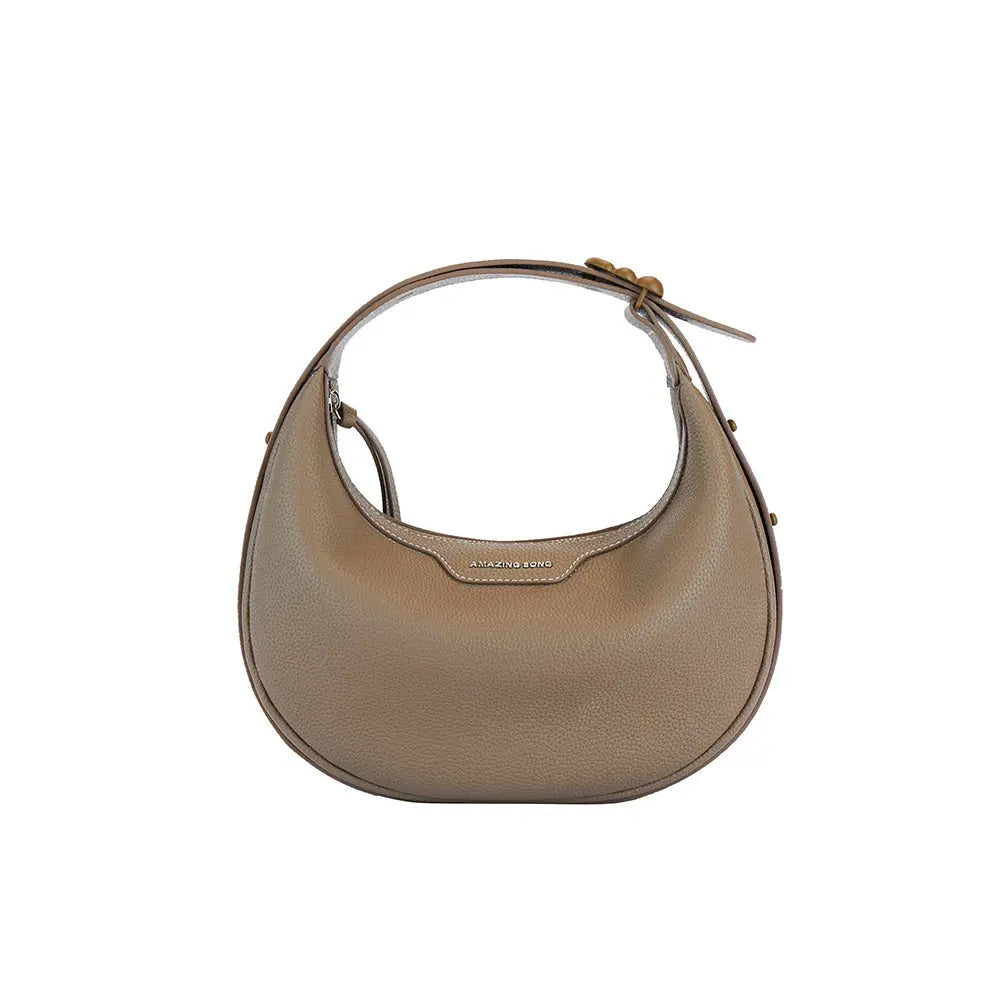 Amazing Song taupe leather crescent handbag with top handle on white background