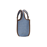 Amazing Song blue denim tote bag with brown leather trim on white background