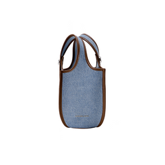Amazing Song blue denim tote bag with brown leather trim on white background