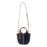 Amazing Song denim handbag with brown trim and adjustable shoulder strap on white background