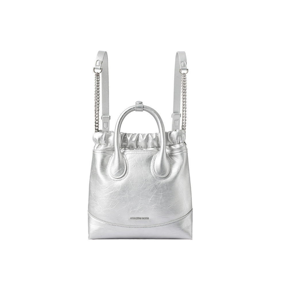 Amazing Song silver metallic backpack purse with chain and leather straps on white background
