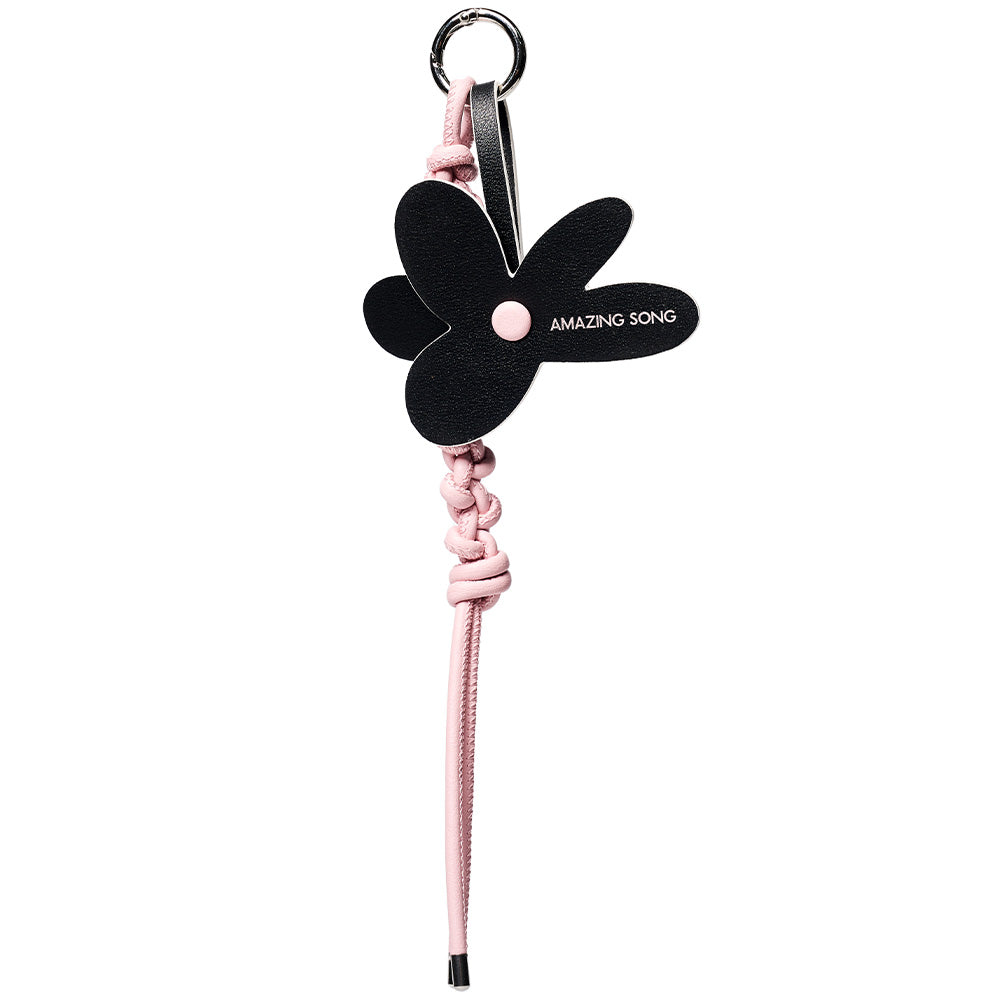 Amazing Song black flower keychain with pink braided strap on white background