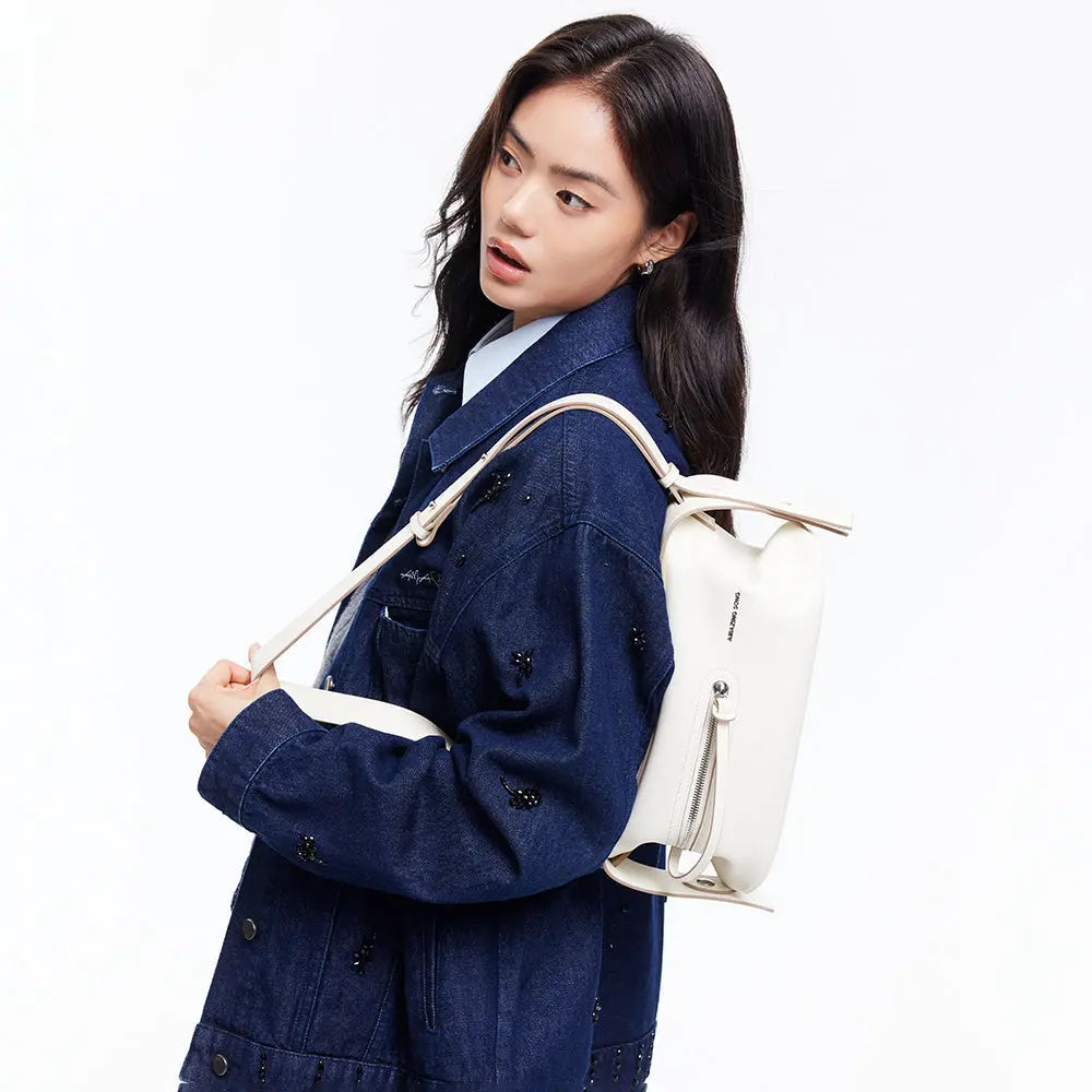 Woman in denim jacket with white backpack, Amazing Song official website fashion accessory