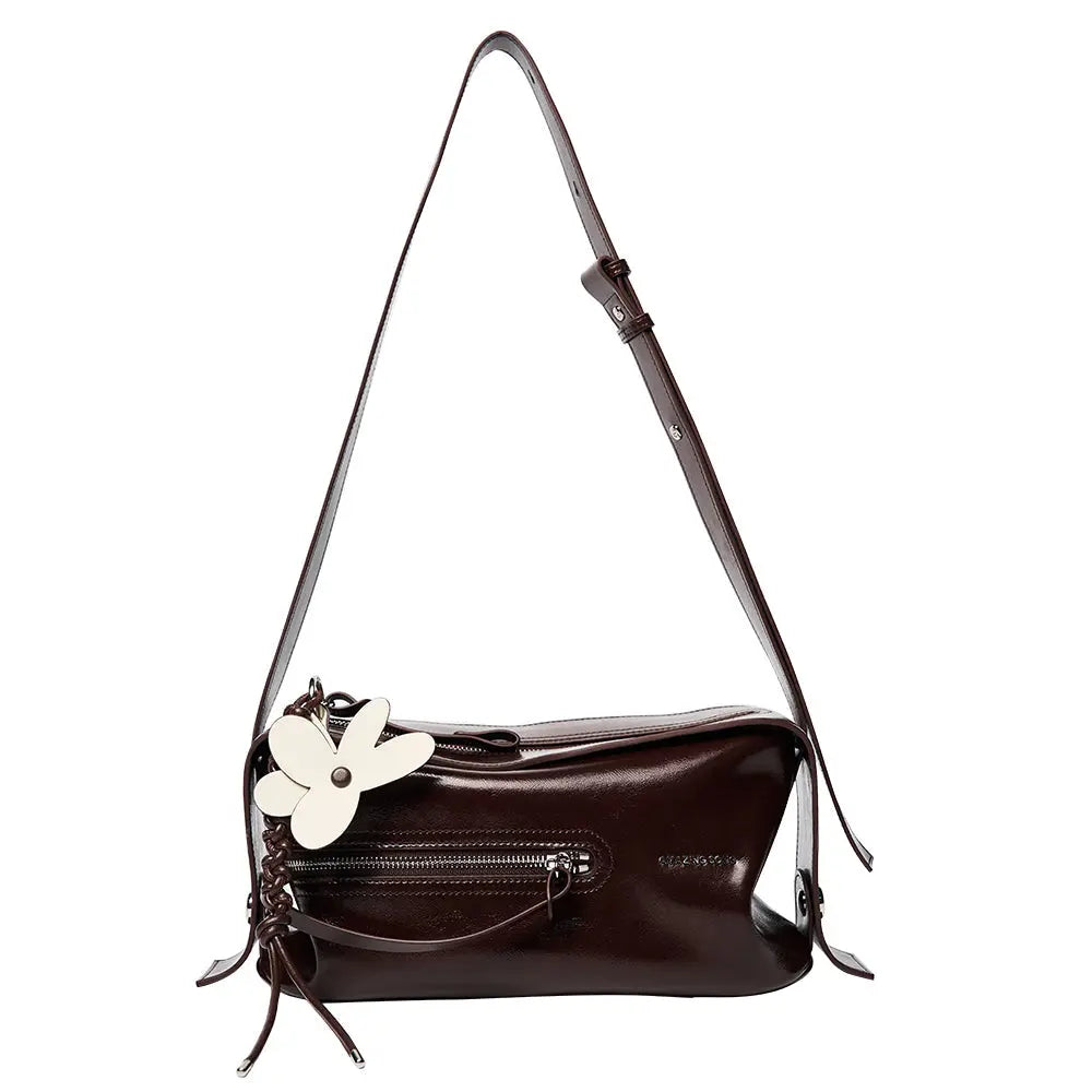 Dark brown leather shoulder bag with front zipper and white flower accent, Amazing Song