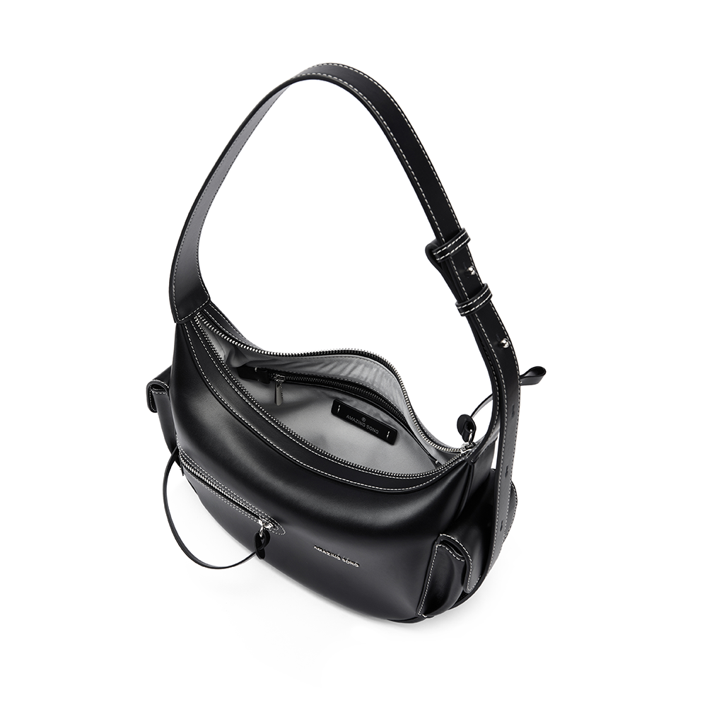 Amazing Song black leather shoulder bag with white stitching, open top view