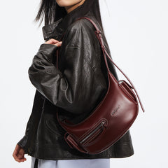 Woman wearing black leather jacket with burgundy leather shoulder bag, Amazing Song style