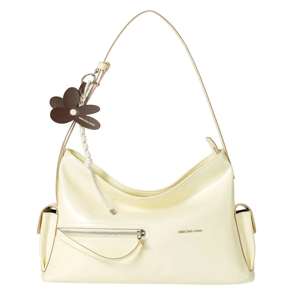 Amazing Song cream shoulder bag with front zipper pocket and brown flower keychain