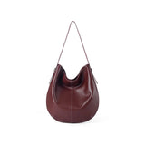 Burgundy leather hobo bag with single strap on white background, Amazing Song
