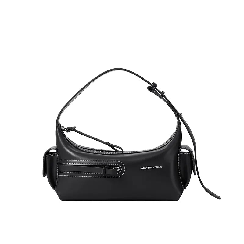 Amazing Song black shoulder bag with white stitching and side pockets on white background