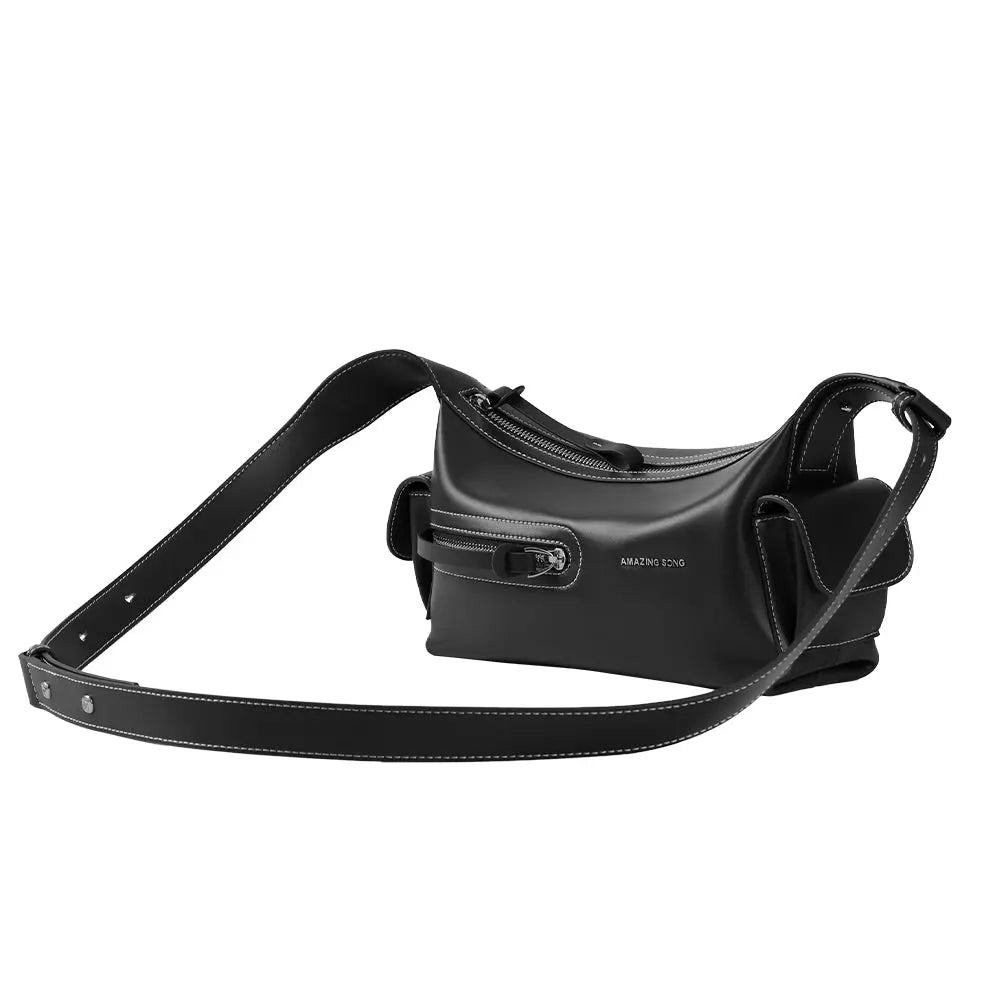 Amazing Song black leather crossbody bag with white stitching and front zipper pocket