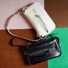 Amazing Song black and white leather handbags with zippers on colorful background